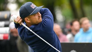 Xander Schauffele takes a shot during the Presidents Cup