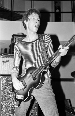 American bass player Mike Mills, of the group R.E.M., performs during a free concert in the student center at the University of Georgia's Memorial Hall, Athens, Georgia, May 16, 1980. The band, opening for a group called The Brains, first performed in April 1980.