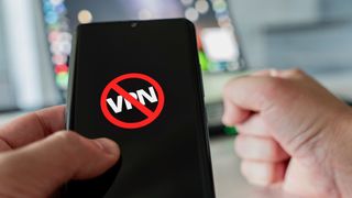 A smartphone displaying the word "VPN", covered by a stop symbol.