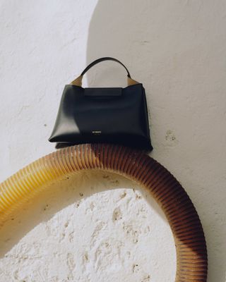 Bag balancing on pipe in sunshine