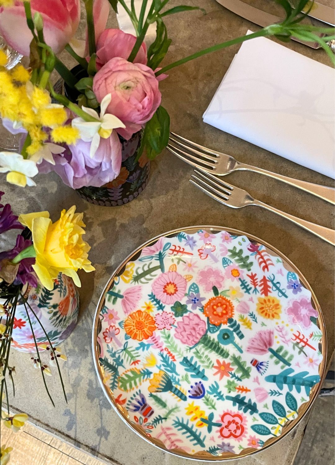 Lucy Tiffney collection plate on a wooden table