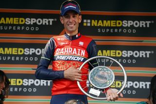 Vincenzo Nibali (Bahrain-Merida) and the trophy for winner of Il Lombardia