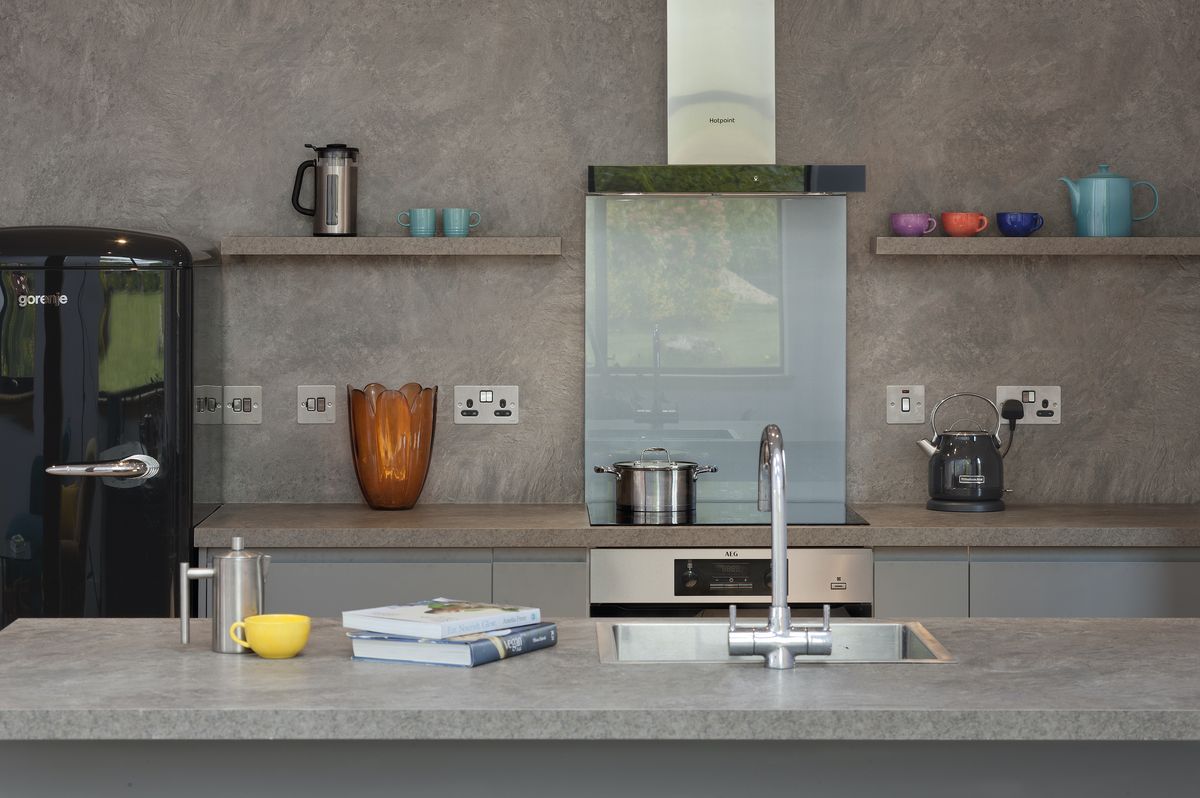 The inexpensive but stylish kitchen is from Howdens.