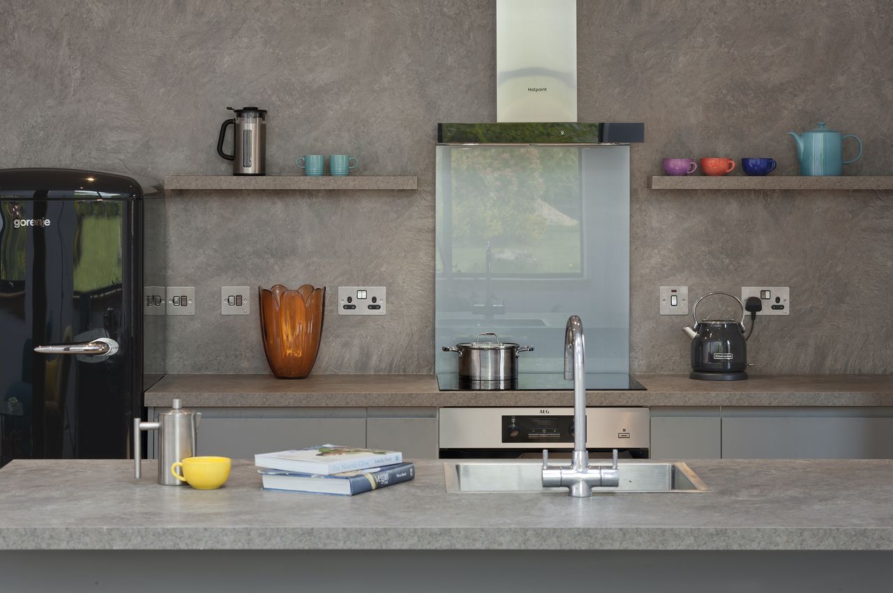 The inexpensive but stylish kitchen is from Howdens.