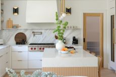 An all-white Parisian-style kitchen