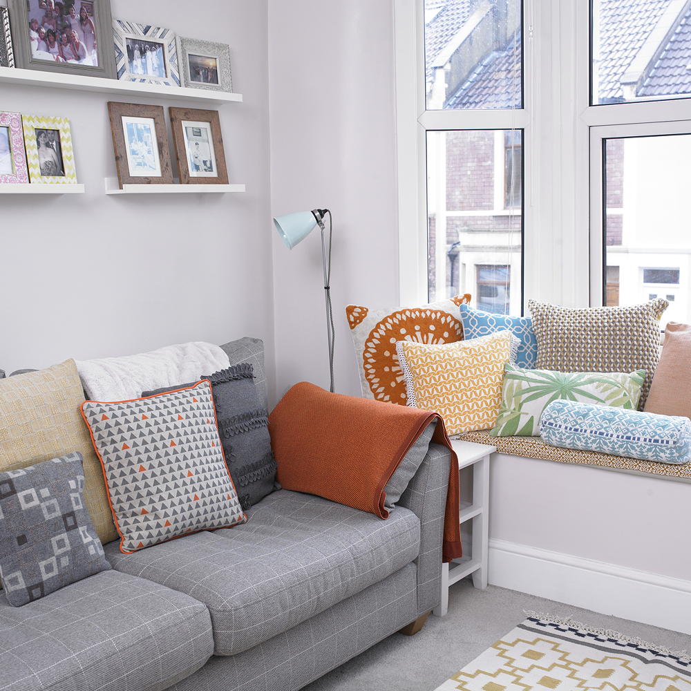 room with sofa and white wall