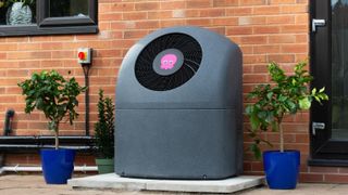 air source heat pump located on exterior of brick built home
