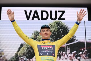 VADUZ LIECHTENSTEIN JUNE 09 Yves Lampaert of Belgium and Team Soudal QuickStep celebrates at podium as Yellow leader jersey winner during the 87th Tour de Suisse 2024 Stage 1 a 477km individual time trial stage from Vaduz to Vaduz UCIWT on June 09 2024 in Vaduz Liechtenstein Photo by Tim de WaeleGetty Images
