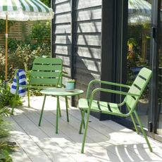 Habitat Annika 2 Seater Metal Garden Bistro Set in green on a patio