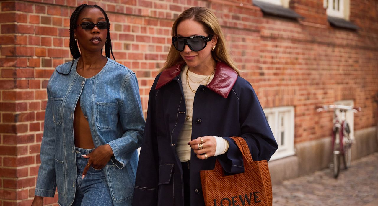 two women in denim jackets and fall clothing in Copenhagen 