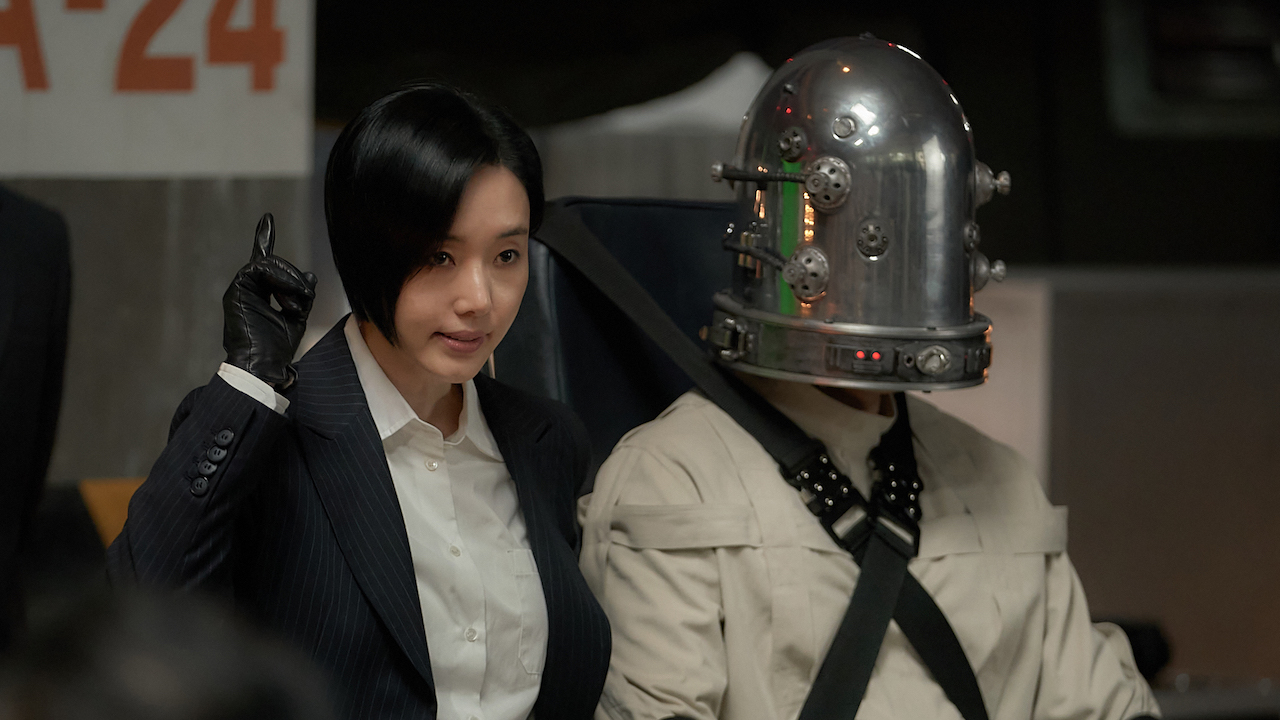 Jung Soo-in next to a man wearing a metal helmet with lights in 