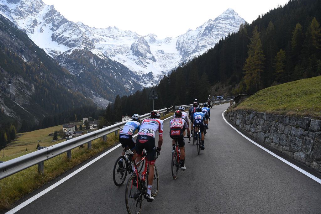 LAGHI DI CANCANO ITALY OCTOBER 22 Daniel Navarro Garcia of Spain and Team Israel StartUp Nation Joseph Lloyd Dombrowski of The United States and UAE Team Emirates Matthew Holmes of The United Kingdom and Team Lotto Soudal Ben Swift of The United Kingdom and Team INEOS Grenadiers Antonio Pedrero Lopez of Spain and Movistar Team Filippo Ganna of Italy and Team INEOS Grenadiers Sergio Samitier Samitier of Spain and Movistar Team Passo dello Stelvio Stilfserjoch 2758m Mountains Landscape Forest Snow Peloton Breakaway during the 103rd Giro dItalia 2020 Stage 18 a 207km stage from Pinzolo to Laghi di Cancano Parco Nazionale dello Stelvio 1945m girodiitalia Giro on October 22 2020 in Laghi di Cancano Italy Photo by Tim de WaeleGetty Images