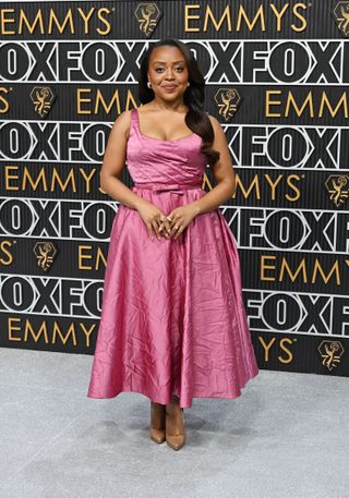 Quinta Brunson wears an intentionally wrinkled magenta dress at the 2024 Emmys