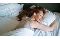 Woman sleeping in bed