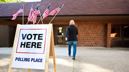 Woman walking inside polling place center