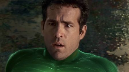 Ryan Reynolds looking confused while wearing the Green Lantern suit.