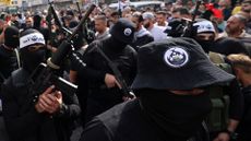 Palestinian militants attend the funeral of Lions’ Den commander Tamer al-Kilani in Nablus on Sunday