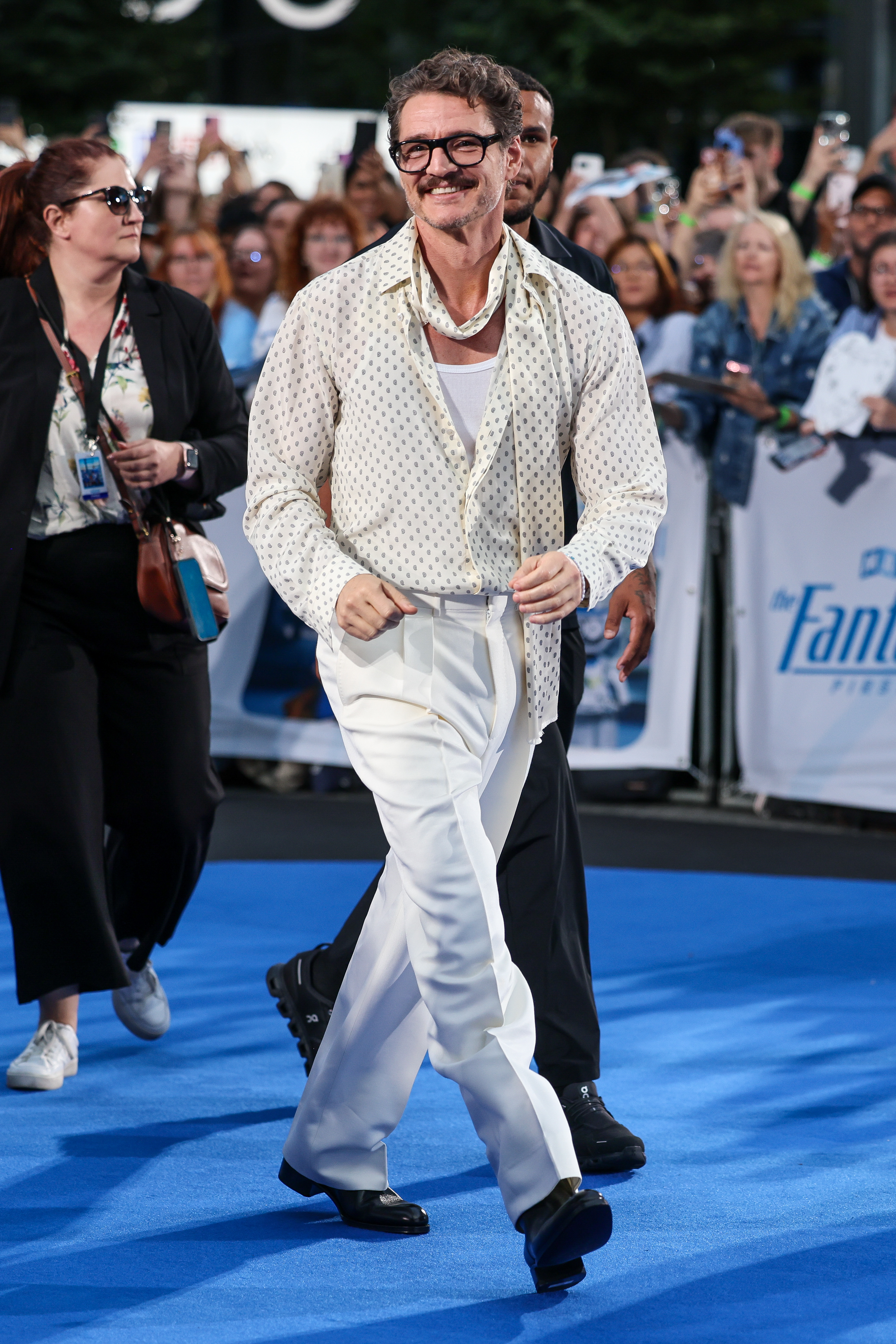 An image of Pedro Pascal wearing a polka-dot top.