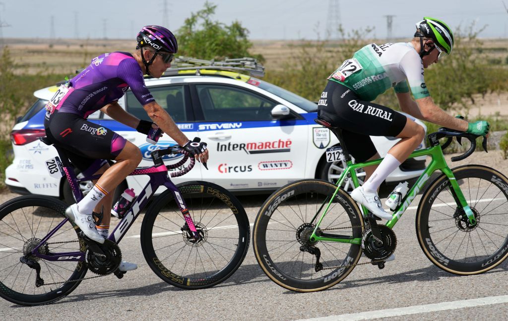 Team Caja RuralSeguros RGAs Spanish rider Abel Balderstone Roumens R leads the race followed by Team Burgos BHs Dutch rider Jetse Bol as they ride in Tauste during the stage 12 of the 2023 La Vuelta cycling tour of Spain a 1506 km race between Olvega and Zaragoza on September 7 2023 Photo by CESAR MANSO AFP Photo by CESAR MANSOAFP via Getty Images