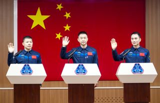 (L-R) Chinese astronauts Wang Jie, Chen Dong and Chen Zhongrui, who will carry out the Shenzhou-20 crewed spaceflight mission, meet the press at Jiuquan Satellite Launch Center on April 23, 2025 in Alxa League, Inner Mongolia Autonomous Region of China.