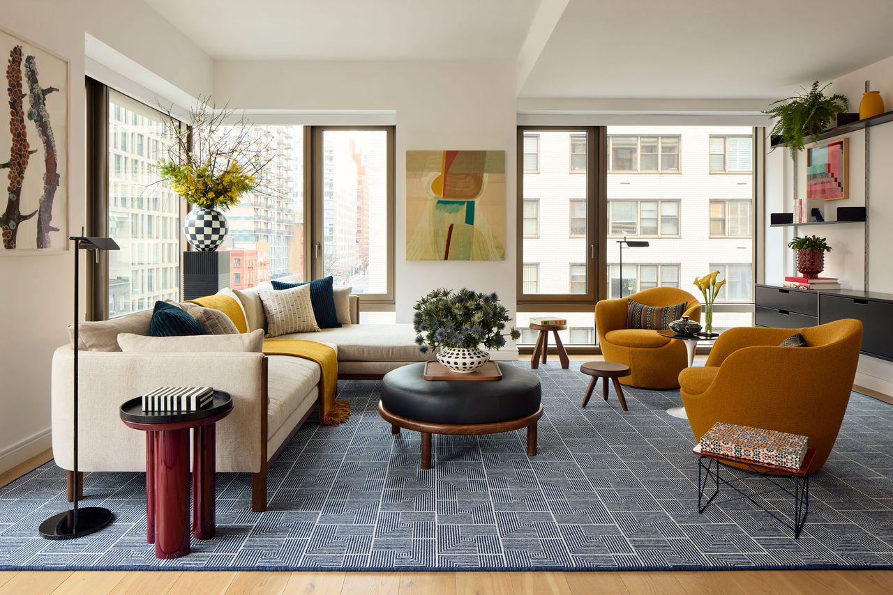 a modern living room in an apartment filled with color