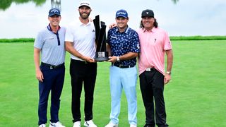 Members of 4 Aces GC pose with the trophy after winning the team event at the third LIV Golf Invitational Series tournament