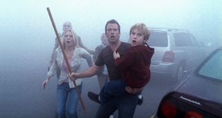 (L to R) Laurie Holden as Amanda, Thomas Jane as David in the mist, showing concern, in The Mist (2007)