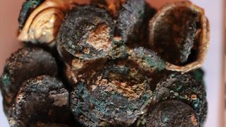 a clump of burnt and charred coins