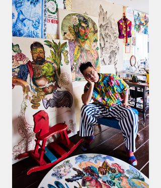 artist at work in his colourful studio