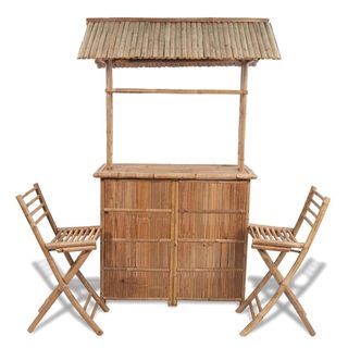 wooden tiki bar with wooden chairs