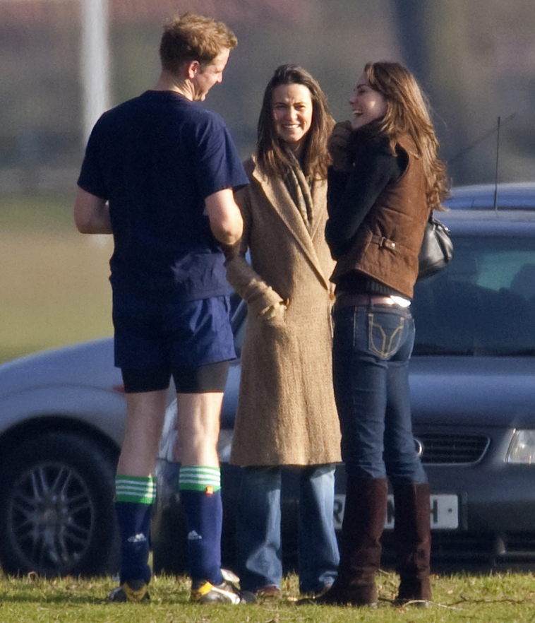 Prince William talking to Kate and Pippa Middleton in front of a car in 2006