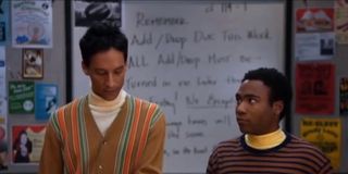Troy and Abed as Bert and Ernie in the library in Community.