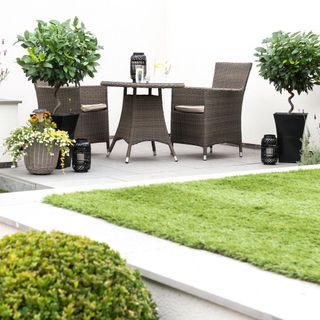garden lawn with black outdoor sitting table