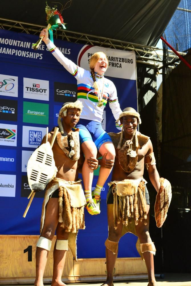 Alexandre Engen of Sweden is hosted in the air at the medal ceremony after she won the women's cross country eliminator