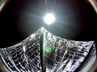 This image was captured by a camera aboard LightSail 1 on June 8, 2015, shortly after solar sail deployment. It was color-corrected by Dan Slater to remove the camera's artificial purplish tint based on ground test images, and is a closer approximation to what the human eye would see.