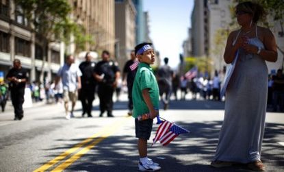 A young demonstrator marches during an immigration reform protest on May 1: Alabama is close to passing an immigration law that's tougher than Arizona's.