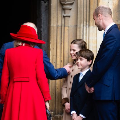 King Charles and Queen Camilla walking into church next to Charlotte, Louis and William