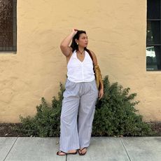 Marina wears white dress in one picture and white halter top with breezy linen pants and black flip flops in the other image