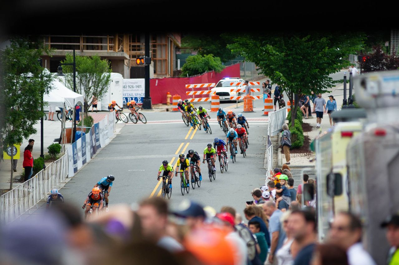 Fans watch as the mens peloton heads back into town at the Winston-Salem Cycling