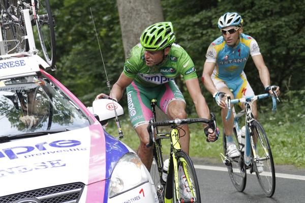 Alessandro Petacchi has a moment with his team car.