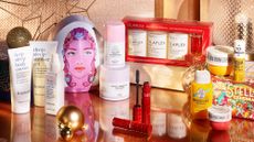 a line up of Christmas gift sets sold at Space NK, including Drunk Elephant and Olaplex - Space NK Black Friday