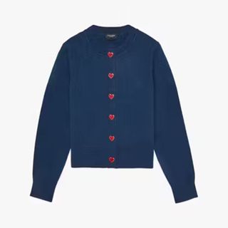 A cutout of a Kate Spade navy cardigan with red heart buttons