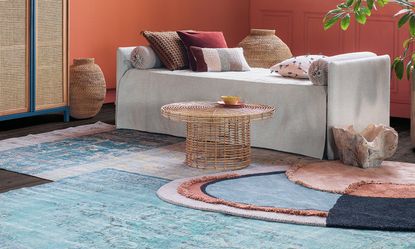 layered rugs in a terracotta living room