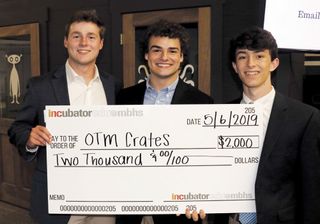 Smiles from the OTM Crates team with their investment check.
