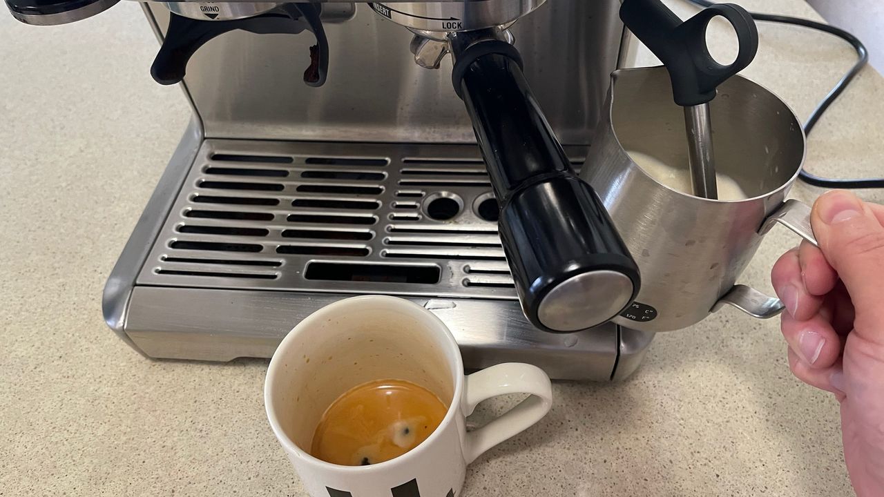 steaming milk with the Breville Barista Express coffee maker