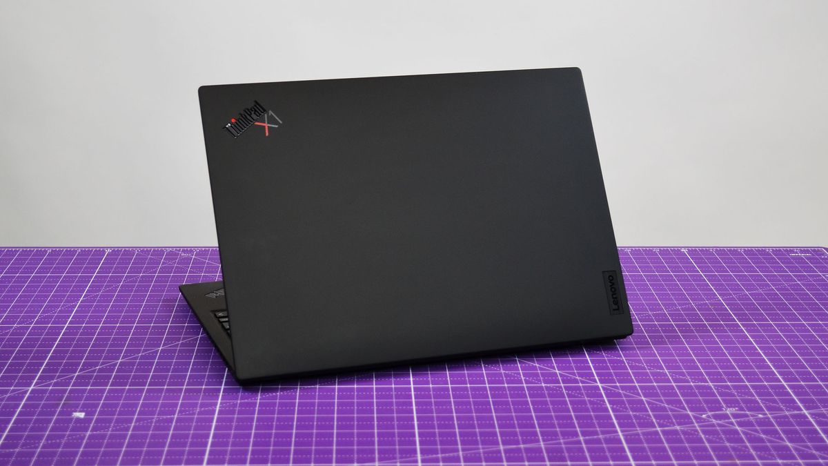 A Lenovo ThinkPad X1 Nano Gen 3 on a desk with a purple desk mat
