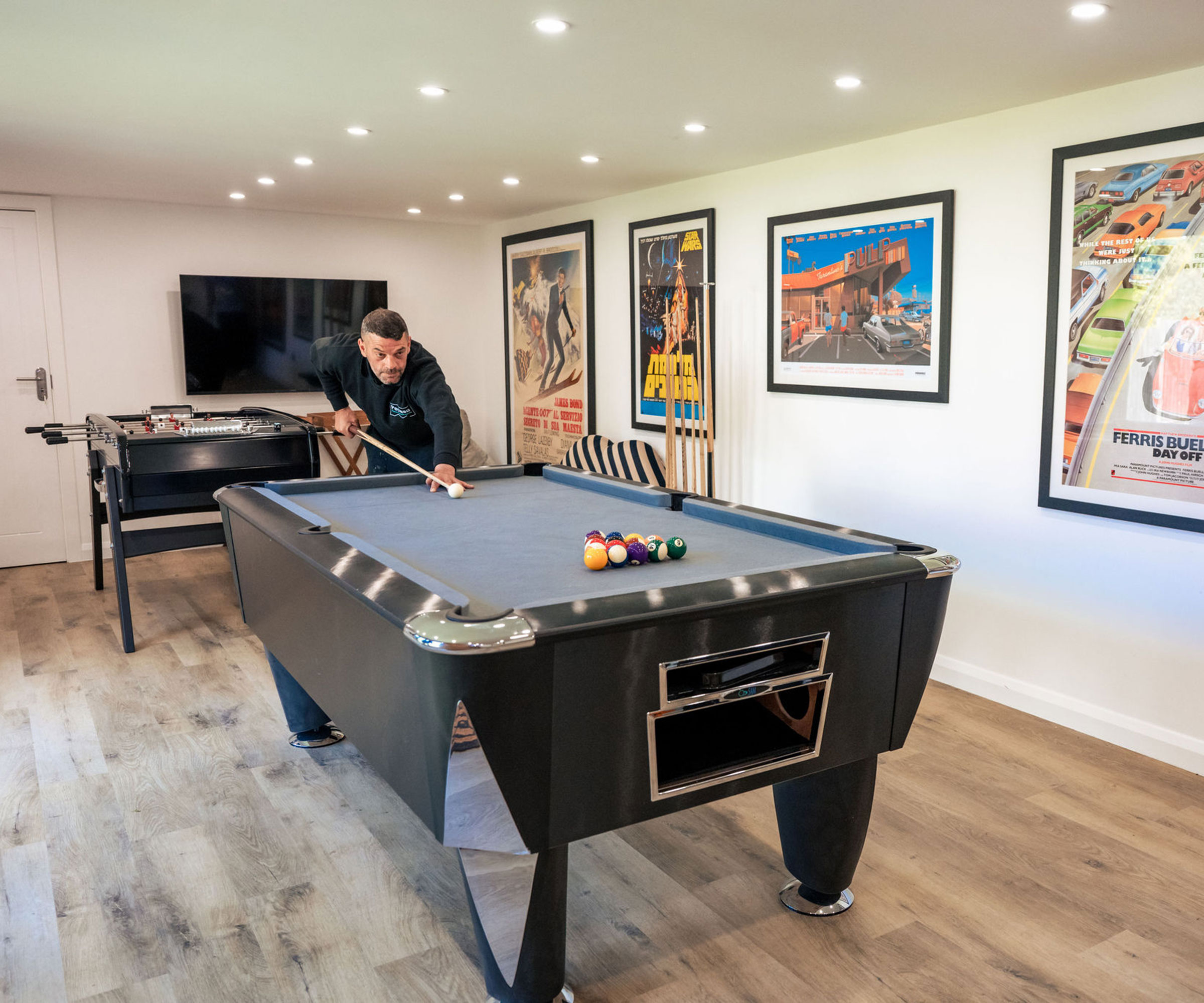 garden room designed to be used as a games room with a pool table and table football