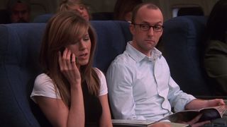Jim Rash plays a paranoid passenger next to Rachel in Friends