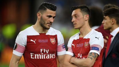 Sead Kolasinac and Mesut Ozil react after Arsenal’s 4-1 loss against Chelsea in the Uefa Europa League final in Baku