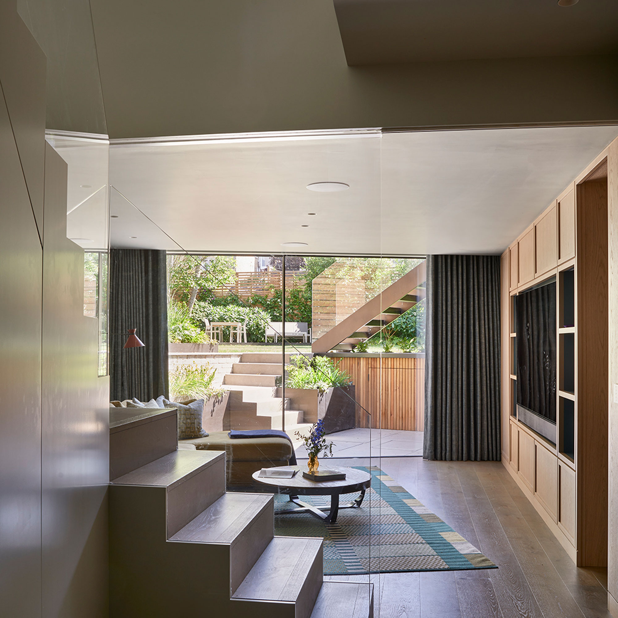 contemporary basement conversion leading to sunken terrace